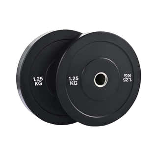 Olympic bumper weight plates set in home gym for strength training, durable rubber plates for safe lifting and deadlifts