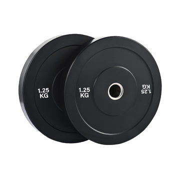 Olympic bumper weight plates set in home gym for strength training, durable rubber plates for safe lifting and deadlifts
